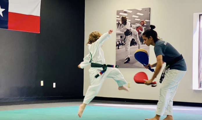Ares Max Becic practicing Tae Kwon Do kicks